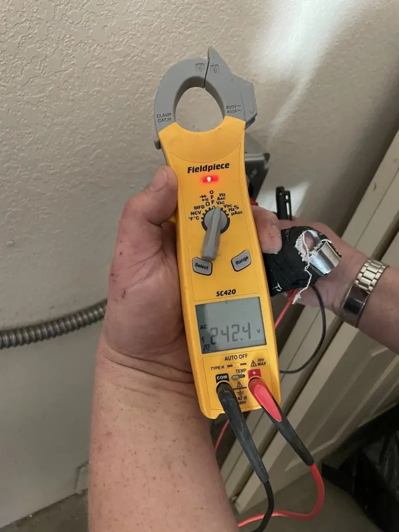 Voltage testing with clamp meter during Electrical Installation Services in Fairport